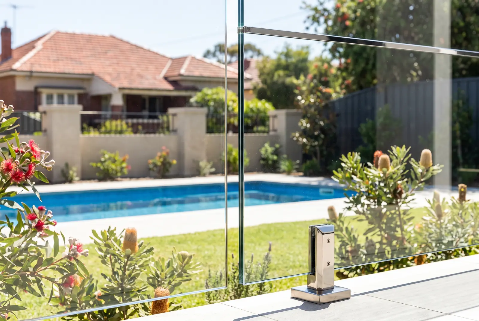 Frameless glass pool fence compliance inspection detail with polished panel in Northbridge WA