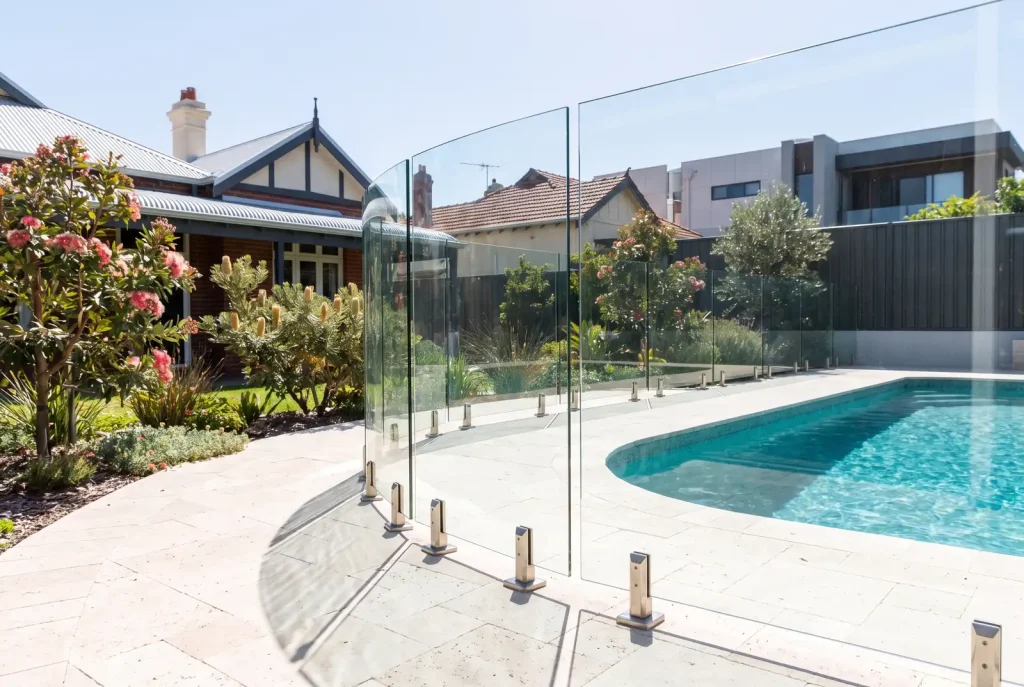 Frameless glass pool fence compliance inspection result beside sparkling pool in Northbridge WA